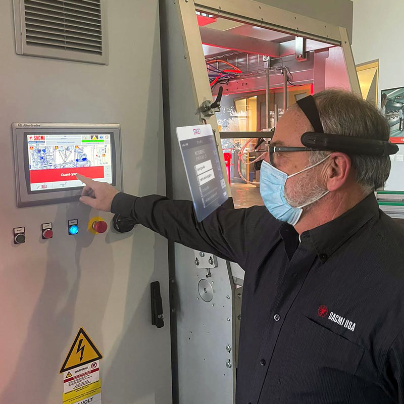 SACMI USA technicians using HMD during maintenance activity