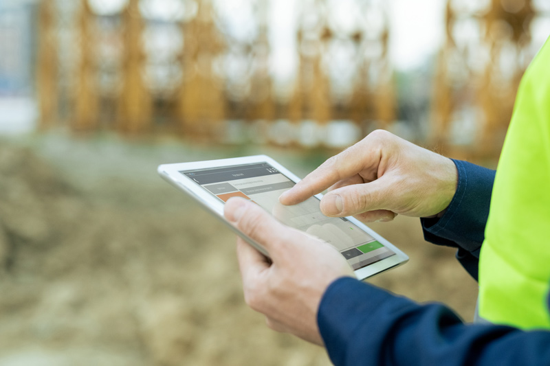 hand-of-engineer-pointing-at-screen-of-tablet